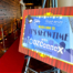 Conference event poster on stand in venue